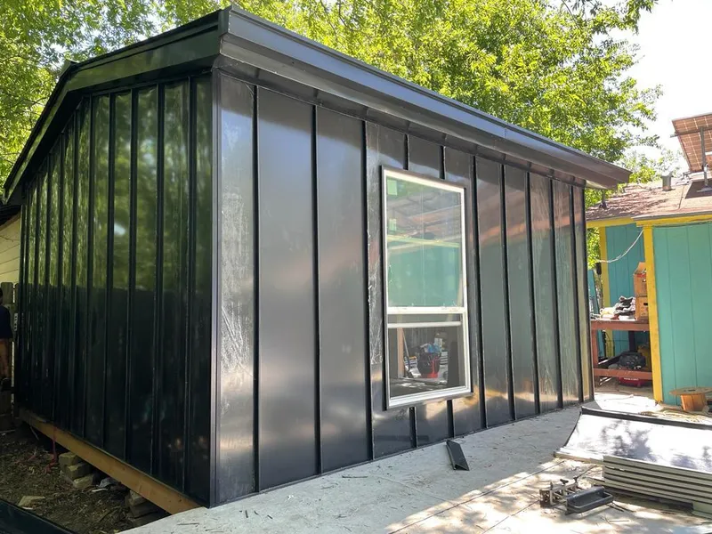 Black standing seam metal wall panels for Metal Roof Installation in Norman